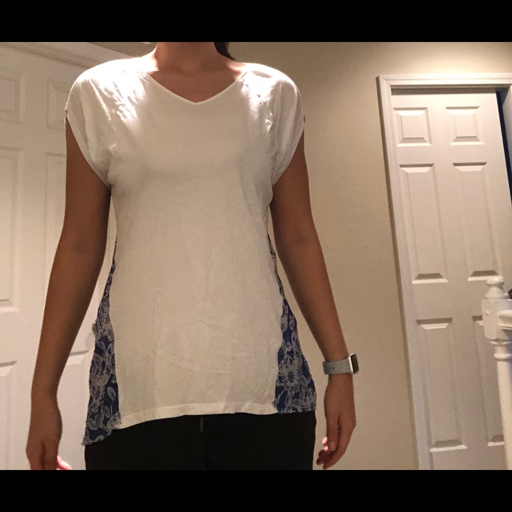 A white top with flowers on the back